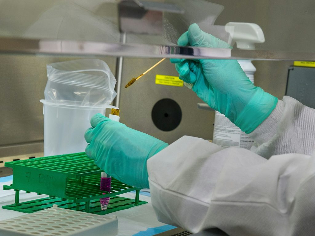 Scientists working in a lab developing new liquid biopsy technologies.